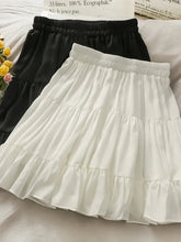 Women's high waist A-line mini skirt in a solid color.